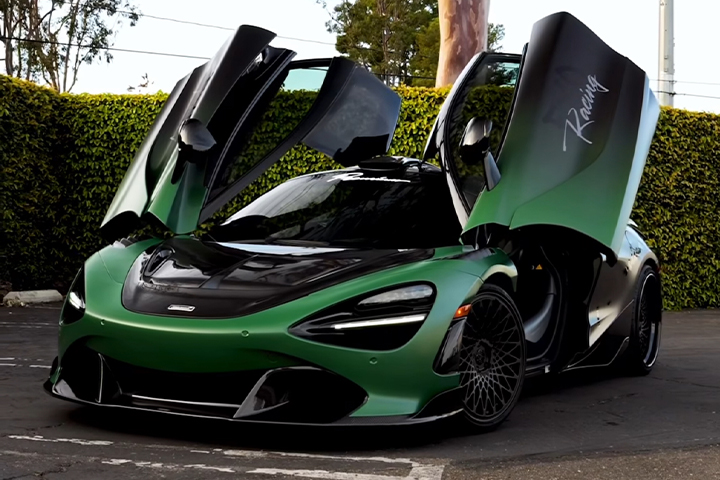 Green McLaren with its doors up
