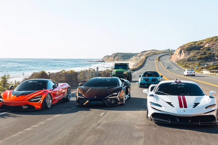 Supercars driving along the coast